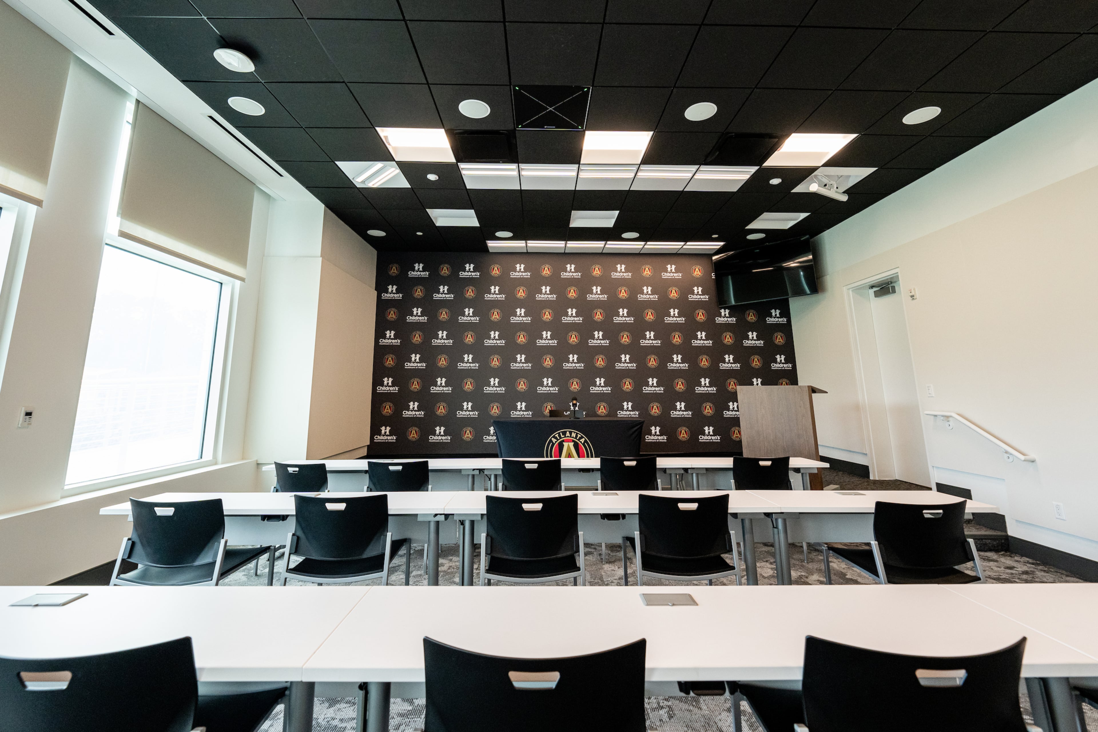 A pan-tilt-zoom camera to capture interviews in the media room is controlled by operators in the upstairs control room at the expanded Children’s Healthcare of Atlanta Training Ground in Marietta. (Mitch Martin/Atlanta United)