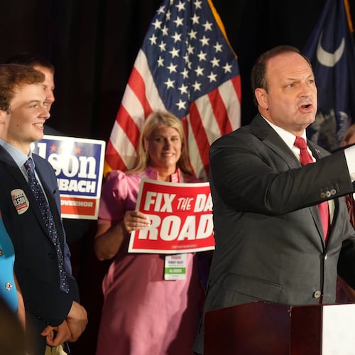 South Carolina Attorney General Alan Wilson speaks to supporters, accompanied by his wife Jennifer and their children, Michael, left, and Anna Grace, during his gubernatorial runoff victory party in Columbia, S.C., Tuesday, June 23, 2026. (AP Photo/Meg Kinnard)