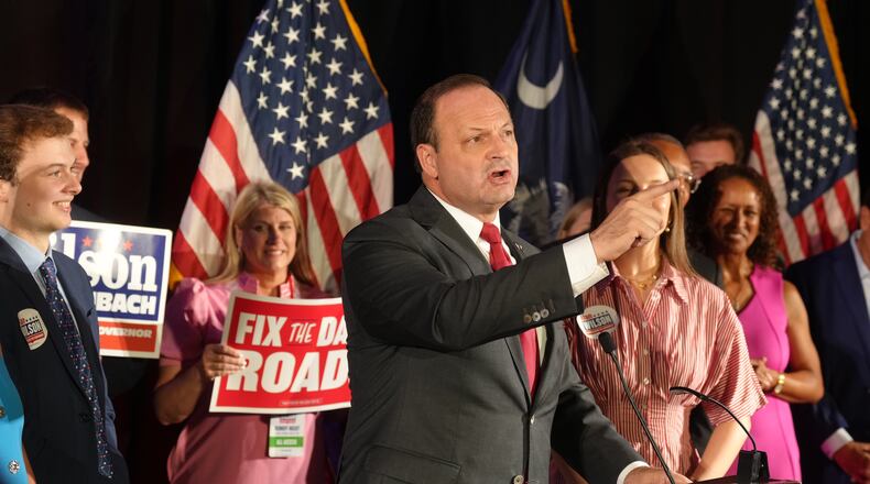South Carolina Attorney General Alan Wilson speaks to supporters, accompanied by his wife Jennifer and their children, Michael, left, and Anna Grace, during his gubernatorial runoff victory party in Columbia, S.C., Tuesday, June 23, 2026. (AP Photo/Meg Kinnard)