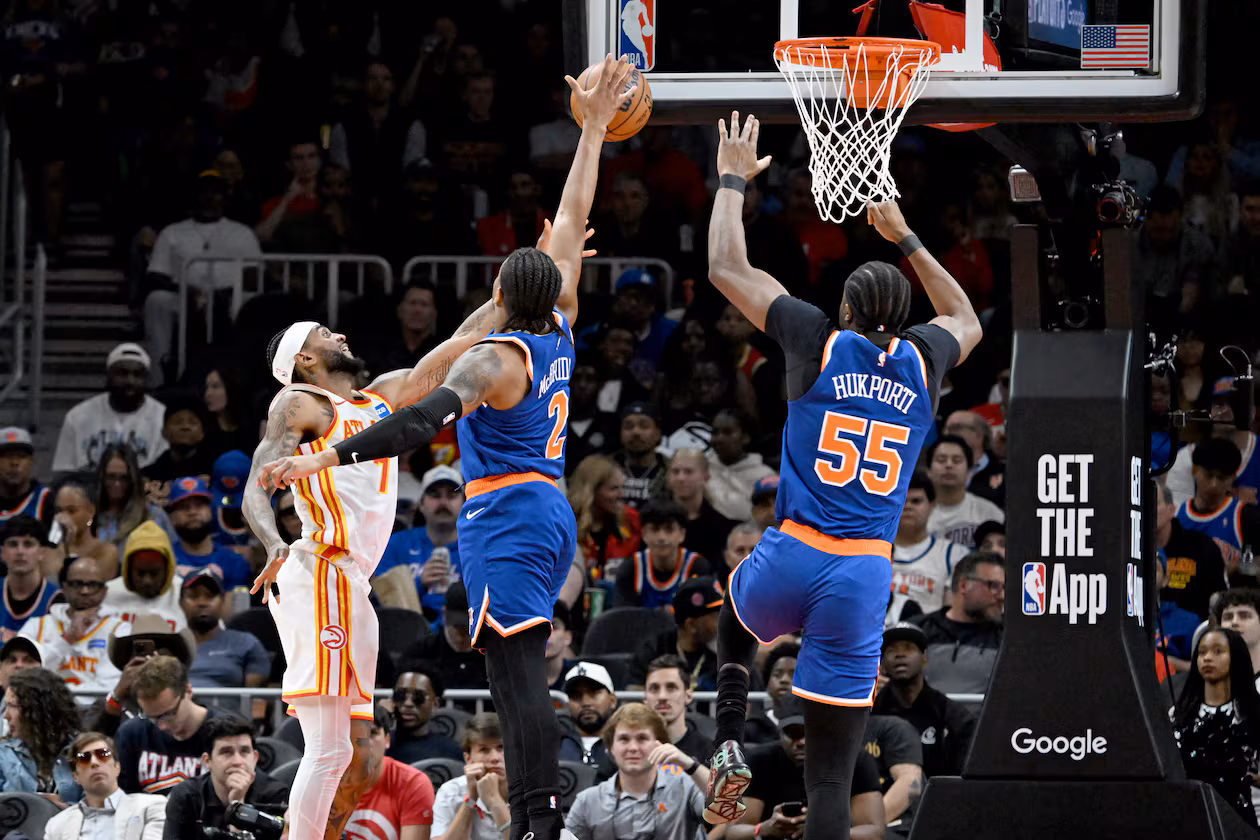 Knicks guard Miles McBride blocks a shot attempt by Hawks guard Nickeil Alexander-Walker during the second half of Game 6 of their first-round NBA playoff series at State Farm Arena on Thursday, April 30, 2026, in Atlanta. New York Knicks won 140-89 over Atlanta Hawks. (Hyosub Shin/AJC)