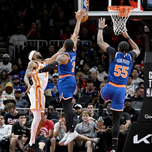 Knicks guard Miles McBride blocks a shot attempt by Hawks guard Nickeil Alexander-Walker during the second half of Game 6 of their first-round NBA playoff series at State Farm Arena on Thursday, April 30, 2026, in Atlanta. New York Knicks won 140-89 over Atlanta Hawks. (Hyosub Shin/AJC)