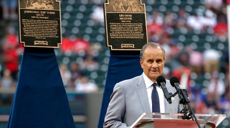 Joseph Paul "Joe" Torre speaks as he is inducted into the Braves Hall of Fame before the baseball game between the Atlanta Braves and the Arizona Diamondbacks Saturday, July 30, 2022, in Atlanta. (AP Photo/Butch Dill)
