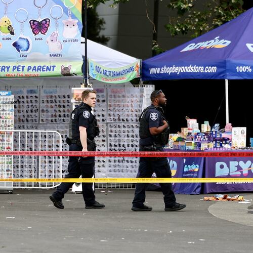 Police respond to a shooting at Seattle Center, according to the Seattle Police Department, during the Bite of Seattle food festival Sunday, July 26, 2026 in Seattle. (Nick Wagner/The Seattle Times via AP)