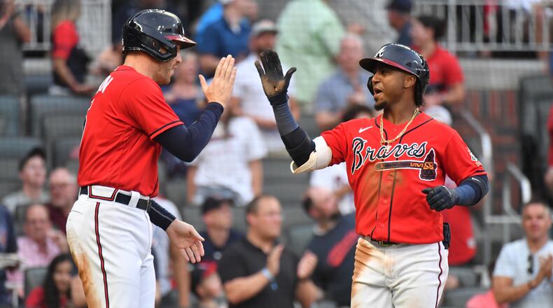 June 18 2021 Atlanta - Atlanta Braves second baseman Ozzie Albies (1) celebrates with Atlanta Braves first baseman Freddie Freeman (5) after hitting one run home run in the second inning at Truist Park on Friday, June 18, 2021. (Hyosub Shin / Hyosub.Shin@ajc.com)