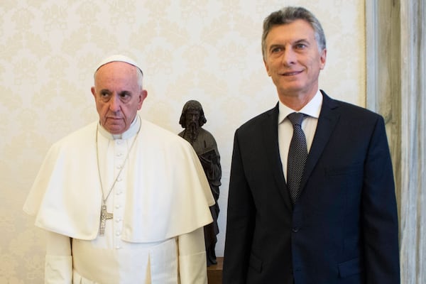 FILE - Pope Francis and Argentina's president Mauricio Macri pose for a picture during a private audience at the Vatican, Feb. 27, 2016. (L'Osservatore Romano/Pool Photo via AP)