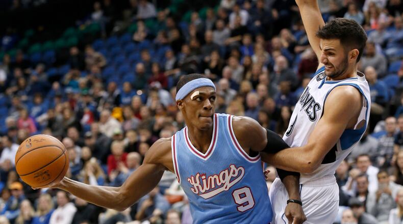 Sacramento Kings guard Rajon Rondo (9) drives against Minnesota Timberwolves guard Ricky Rubio, right, of Spain, during the second half of an NBA basketball game in Minneapolis, Friday, Dec. 18, 2015. The Timberwolves won 99-95. (AP Photo/Ann Heisenfelt)