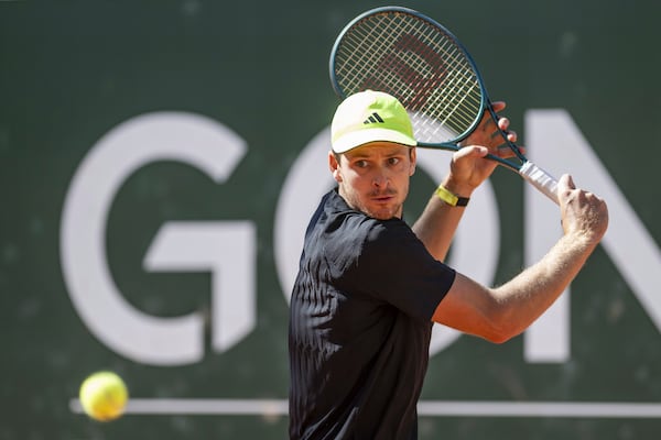 Hubert Hurkacz of Poland returns a ball to Novak Djokovic of Serbia during their final match of the ATP 250 Geneva Open tennis, in Geneva, Switzerland, Saturday, May 24, 2025. (Martial Trezzini/Keystone via AP)