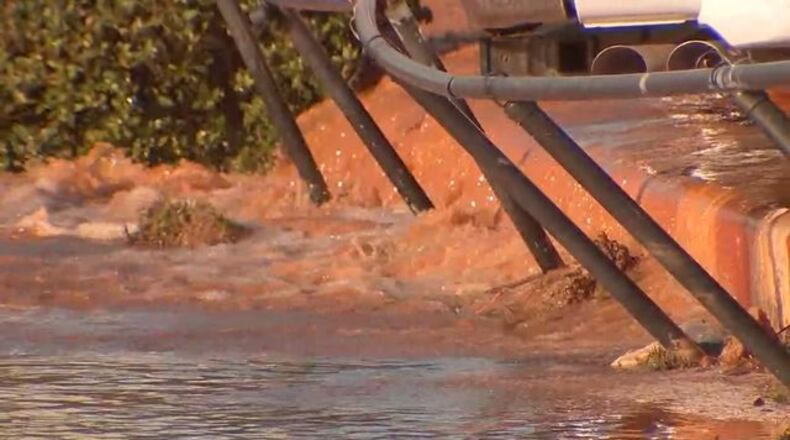 Crews cleaning up after a water main break on Buford Highway in DeKalb County on March 7, 2018.