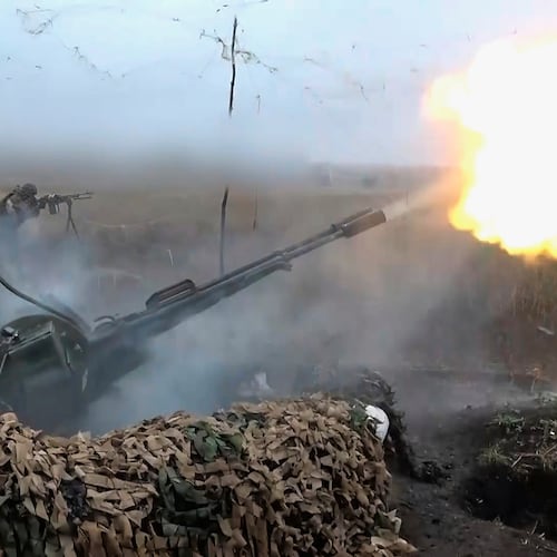 In this image made from video provided by Russian Defense Ministry Press Service on Friday, Nov. 7, 2025, Russian army soldiers fire to shoot a Ukrainian drone on an undisclosed location in Ukraine. (Russian Defense Ministry Press Service via AP)