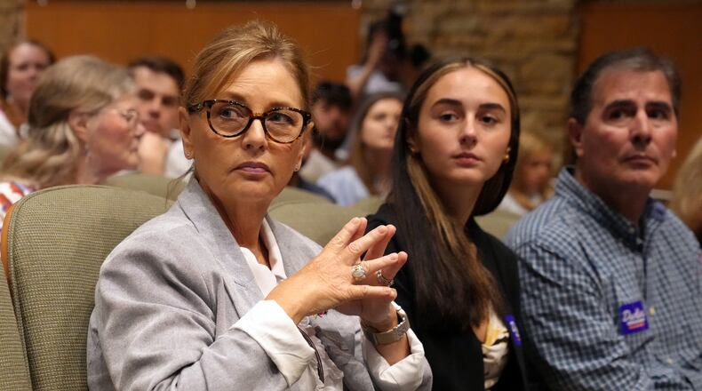 Sen. Darline Graham, R-S.C., from left, seated alongside daughter Nicole Nordone and husband Larry Nordone, looks on as a South Carolina Republican Senate candidate stump event gets underway ahead of the special GOP primary to replace her late brother, Sen. Lindsey Graham, R-S.C., Saturday, Aug. 1, 2026, in Lexington, S.C. (AP Photo/Meg Kinnard)