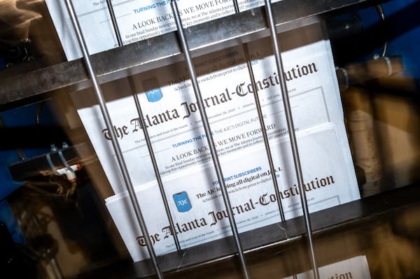 The final Sunday run of The Atlanta Journal-Constitution is shuttled on a conveyer from the printing press at Metro Market Media on Saturday, Dec. 27, 2025, in Gainesville. The AJC will end its printed edition on Dec. 31, after 157 years. (Arvin Temkar/AJC)