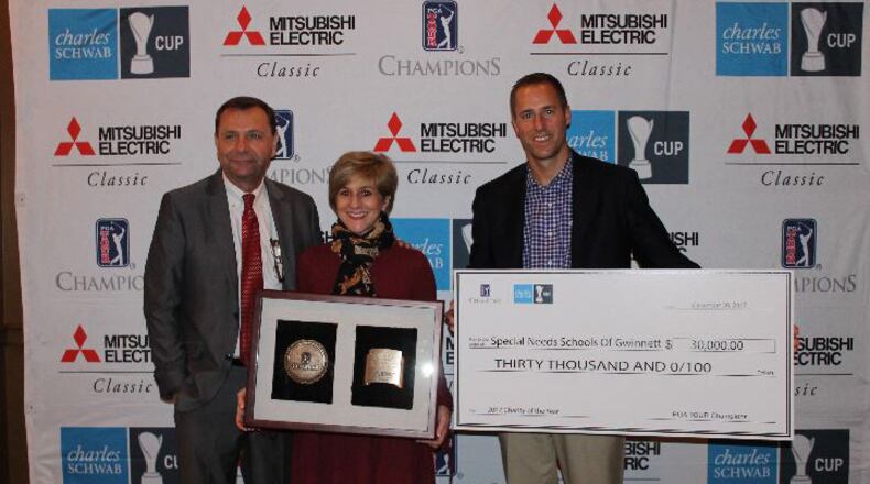 Stan Hall, Executive Director of the Mitsubishi Electric Classic and Gwinnett Sports Commission, Susie Collat, Chairman Special Needs Schools of Gwinnett, and Monte Ortel, Tournament Director, Mitsubishi Electric Classic (from left to right) presented a $30,000 check on Wednesday.