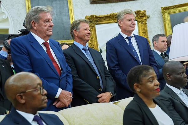 Johann Rupert, left, looks on as President Donald Trump meets South African President Cyril Ramaphosa in the Oval Office of the White House, Wednesday, May 21, 2025, in Washington. (AP Photo/Evan Vucci)