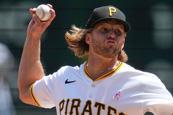 Pittsburgh Pirates pitcher Carmen Mlodzinski delivers during the first inning of a baseball game against the Atlanta Braves in Pittsburgh, Sunday, May 11, 2025. (AP Photo/Gene J. Puskar)