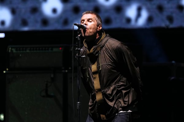 Liam Gallagher from the band Oasis performs during their reunion concert on Friday, July 4, 2025, in Cardiff. (Photo by Scott A Garfitt/Invision/AP)