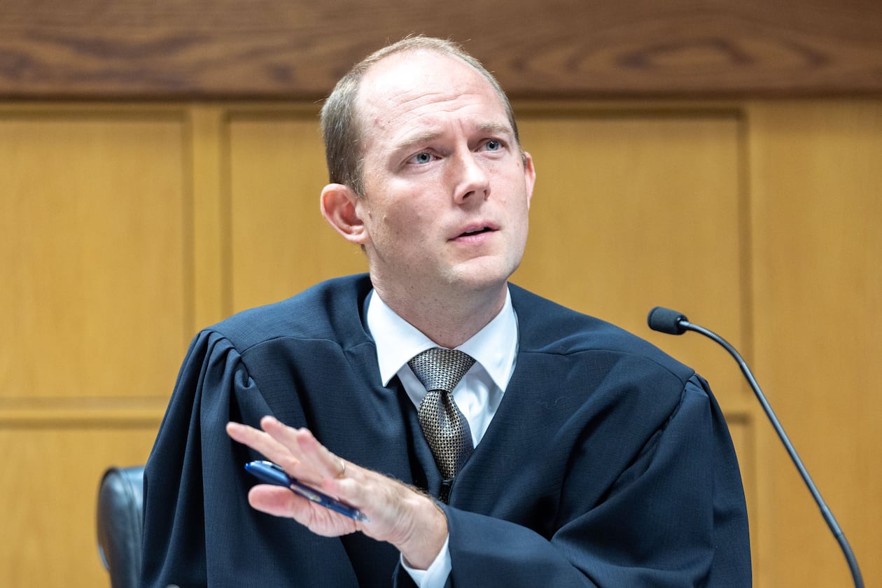 Judge Scott McAfee presides over a hearing regarding media access in the case against former President Donald Trump and 18 others at the Fulton County Courthouse in Atlanta on Aug. 31, 2023. (Arvin Temkar/AJC)