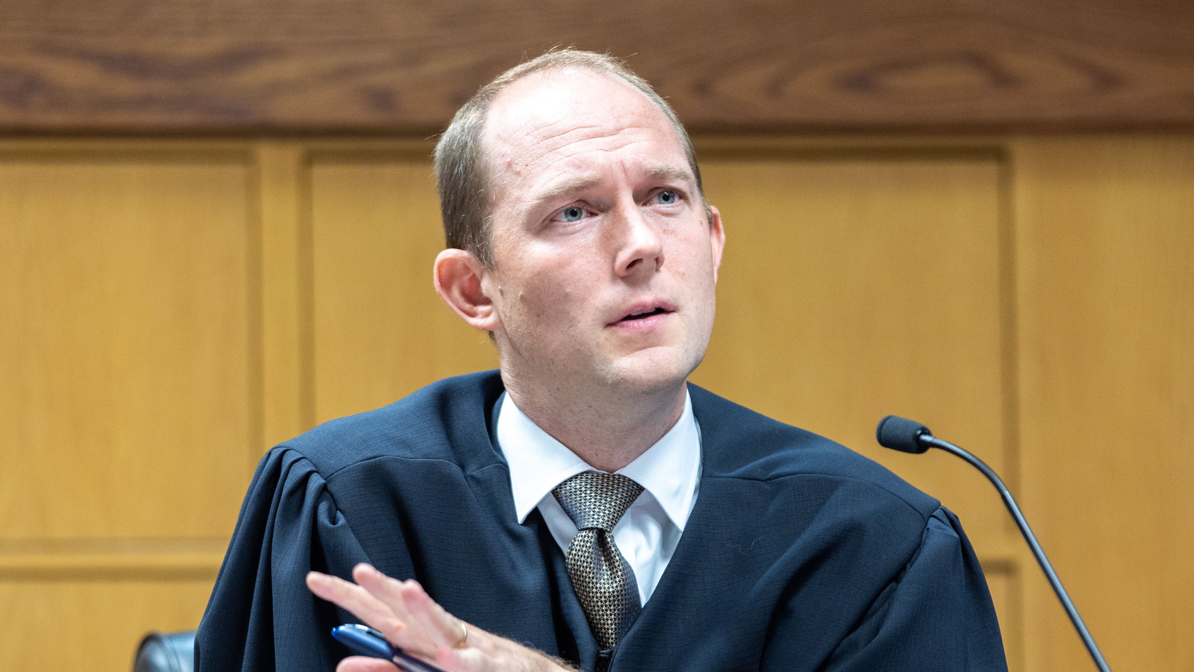 Judge Scott McAfee presides over a hearing regarding media access in the case against former President Donald Trump and 18 others at the Fulton County Courthouse in Atlanta on Aug. 31, 2023. (Arvin Temkar/AJC)