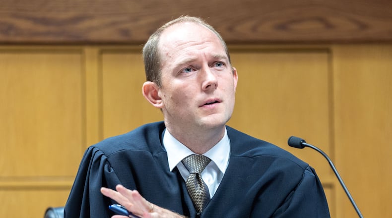 Judge Scott McAfee presides over a hearing regarding media access in the case against former President Donald Trump and 18 others at the Fulton County Courthouse in Atlanta on Aug. 31, 2023. (Arvin Temkar/AJC)