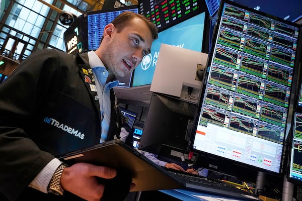 Trader Dylan Halvorsan works on the floor of the New York Stock Exchange, Friday, April 25, 2025. (AP Photo/Richard Drew)