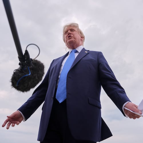 President Donald Trump speaks with reporters before boarding Air Force One, Friday, Aug. 14, 2026, at Joint Base Andrews, Md. (AP Photo/Julia Demaree Nikhinson)