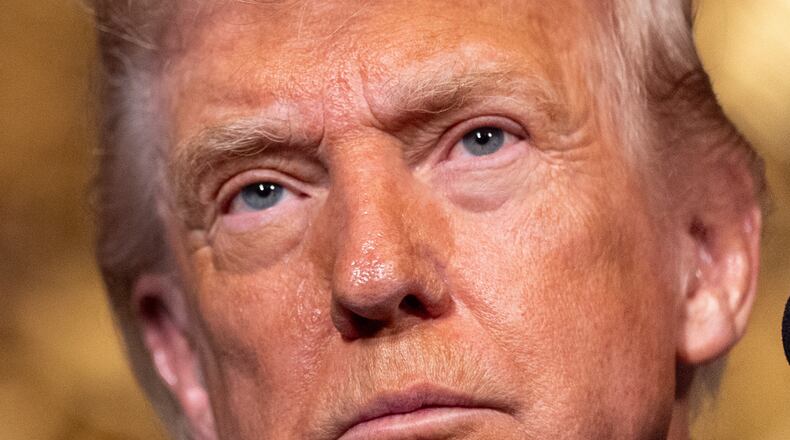 President Donald Trump listens to a question as he speaks at his Mar-a-Lago club, Monday, Dec. 22, 2025, in Palm Beach, Fla. (AP Photo/Alex Brandon)