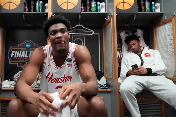 Houston's Cedric Lath sits in the locker room after Florida beat Houston in the national championship at the Final Four of the NCAA college basketball tournament, Monday, April 7, 2025, in San Antonio. (AP Photo/Stephanie Scarbrough)