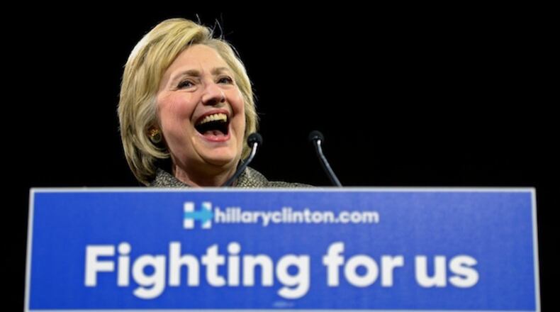 Democratic presidential candidate Hillary Clinton arrives onstage at her victory party at the Philadelphia Convention Center on Tuesday, April 26, 2016. Her husband, former president Bill Clinton is at lower left. (Tom Gralish/The Philadelphia Inquirer via AP) MANDATORY CREDIT
