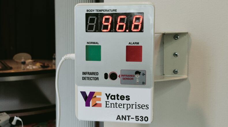 A mounted, non-contact infrared thermal detector will screen for elevated temperatures as employees and volunteers enter the Atlanta Community Food Bank building. The detector was donated by Yates Enterprises, an African American-owned business in Chicago. CONTRIBUTED