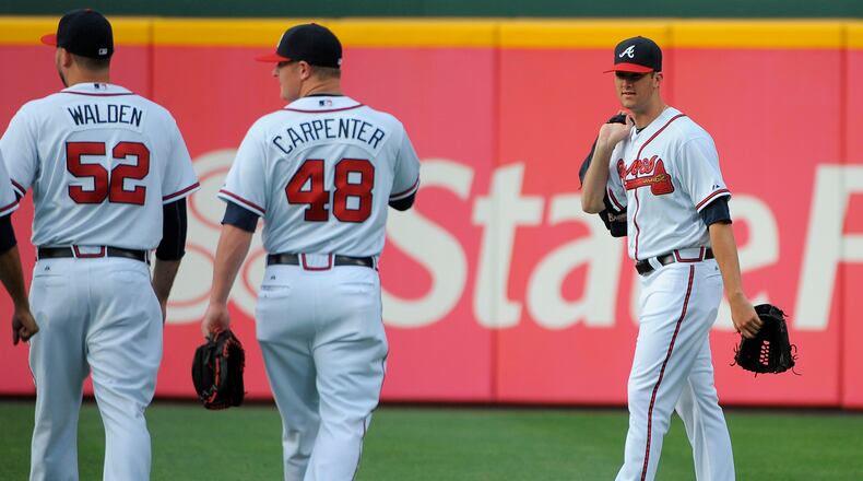 Atlanta Braves pitcher Alex Wood, right, who was called up from the minor leagues earlier in the day, walks toward the bullpen before the Braves' baseball game against the Toronto Blue Jays at Turner Field in Atlanta, Thursday, May 30, 2013. (AP Photo/David Tulis)