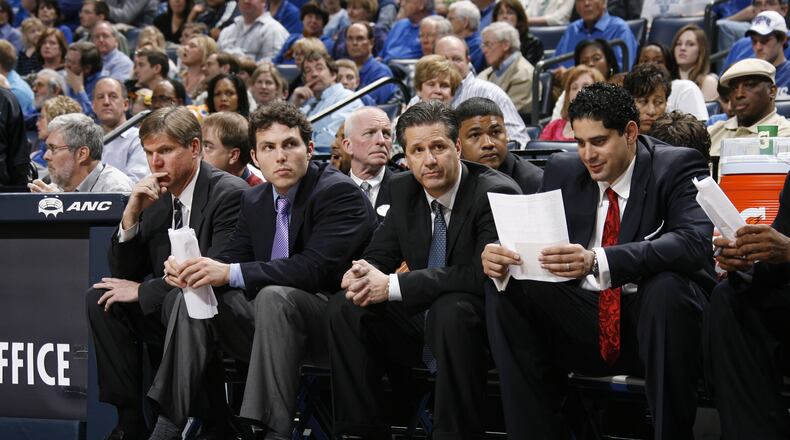 In a March 2009 photo, then-Memphis coach John Calipari sits next to his then-assistant Josh Pastner during a game against Tulane. In a month's time from the photo, Calipari was coach at Kentucky and Pastner was his replacement at Memphis. (Joe Murphy)