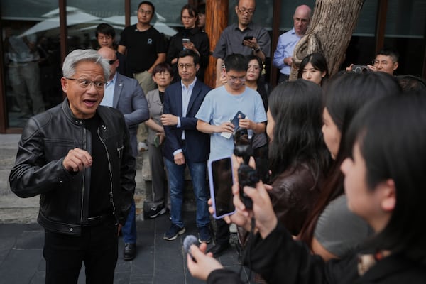 CEO of Nvidia Jensen Huang speaks to journalists during a press conference at the Mandarin Oriental Qianmen after attending the third China International Supply Chain Expo, in Beijing, Wednesday, July 16, 2025. (AP Photo/Andy Wong)
