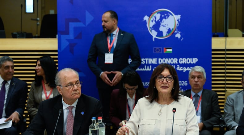 European Commissioner for the Mediterranean Dubravka Suica, right, and Palestinian Prime Minister Mohammad Mustafa participate in a round table meeting of the Palestinian Donor Group at EU headquarters in Brussels, Monday, July 13, 2026. (John Thys, Pool Photo via AP)