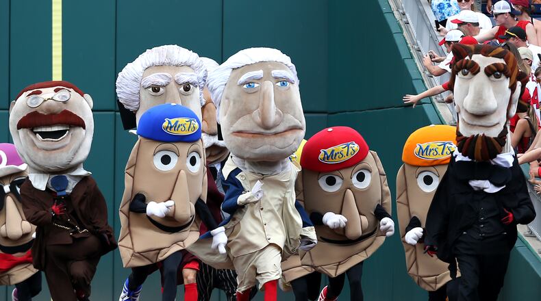 WASHINGTON, DC - JUNE 21: The presidents from The Presidents Race race with the The Pirates Pierogies at Nationals Park on June 21, 2015 in Washington, DC. (Photo by Patrick Smith/Getty Images)