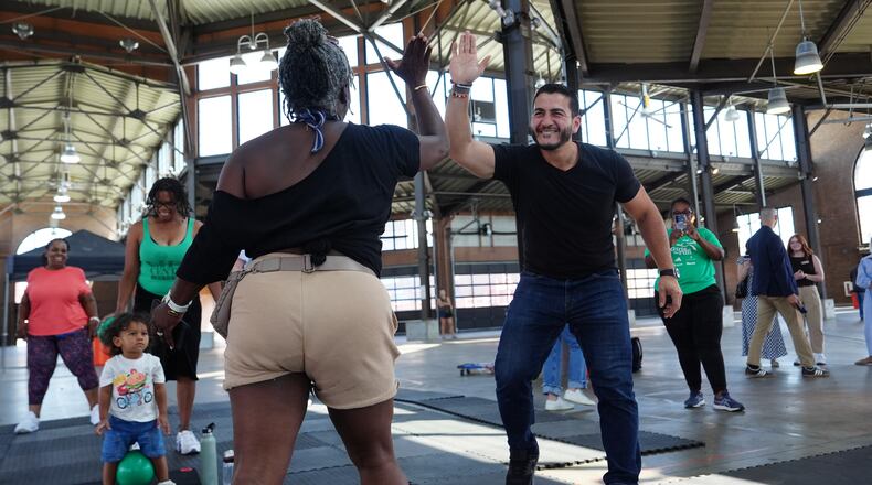 Abdul El-Sayed, a progressive candidate in the Democratic primary for U.S. Senate in Michigan, visits Eastern Market on election day, Tuesday, Aug. 4, 2026, in Detroit. (AP Photo/Julia Demaree Nikhinson)