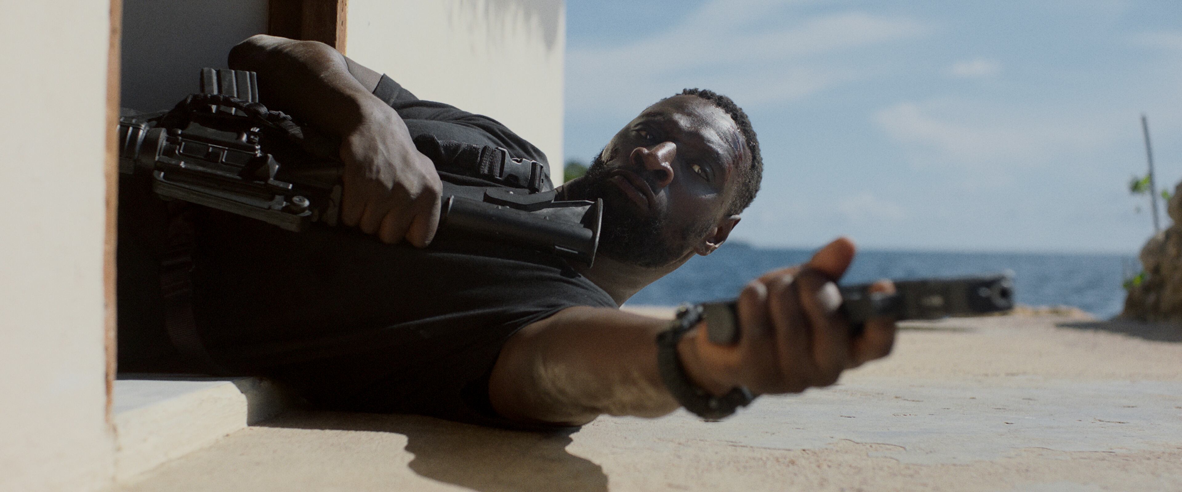 Typically, the man fights off the baddies while the mom takes care of the child. But Isaac in “Shadow Force,” portrayed by Omar Sy, plays primary parent in a way that is sweet and loving. (Courtesy of Lionsgate)