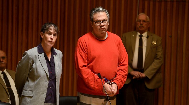 Travis Frink, of Warwick, Rhode Island, stands with his attorney, Public Defender Rebecca McKinnon, during his arraignment in Grafton County Superior Court in North Haverhill, N.H., on Sept. 13, 2017. Frink, 48, is charged with first-degree murder in the death of his 70-year-old mother, Pamela Ferriere, on Tuesday in the intensive care unit at Dartmouth-Hitchcock Medical Center in Lebanon, N.H. (Jennifer Hauck/The Valley News via AP, Pool)