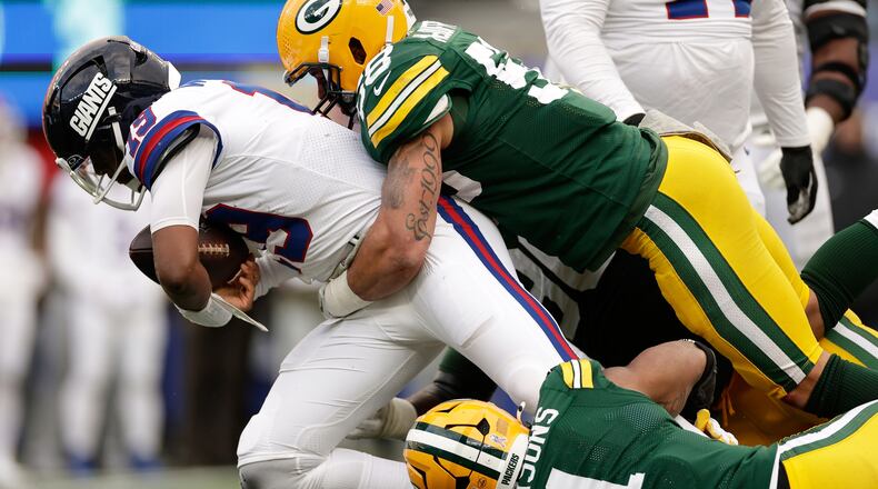 FILE - Green Bay Packers' Micah Parsons and Isaiah McDuffie sack New York Giants' Jameis Winston during the second half of an NFL football game, Nov. 16, 2025, in East Rutherford, N.J. (AP Photo/Adam Hunger, File)