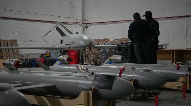 Servicemen of Ukraine's defense intelligence set up drones against Russian in an undisclosed location in Ukraine late Thursday, May 28, 2026. (AP Photo/Efrem Lukatsky)