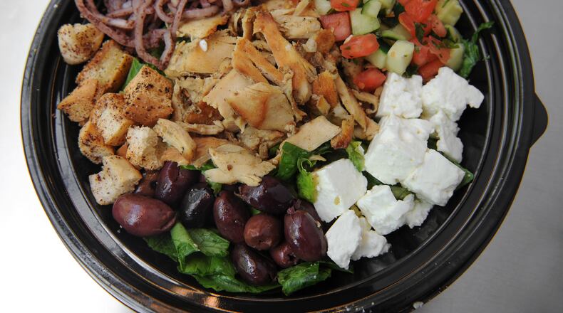 Mediterranean Salad- Romaine lettuce, chicken shawarma, kalamata olives, feta cheese, tomato & cucumber salad, spiced onions, pita crisps & Bezoria vinaigrette. (Beckysteinphotography.com) Mediterranean Salad- Romaine lettuce, chicken shawarma, kalamata olives, feta cheese, tomato & cucumber salad, spiced onions, pita crisps & Bezoria vinaigrette. (Beckysteinphotography.com)