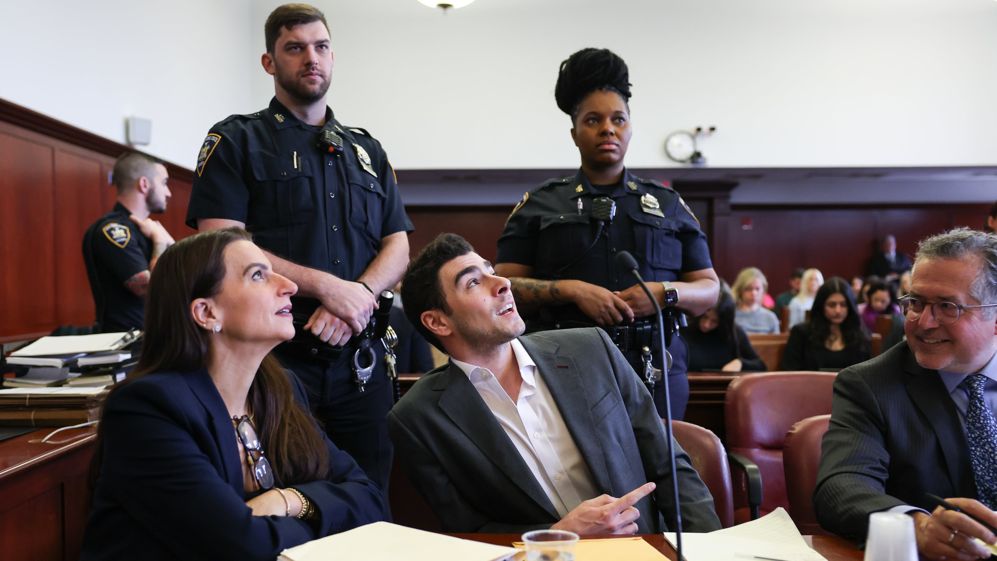 Luigi Mangione appears in court alongside his attorneys Karen Friedman Agnifilo, left, and Marc Agnifilo for an evidence hearing, Thursday, Dec. 4, 2025, in New York. (Angela Weiss/Pool Photo via AP)