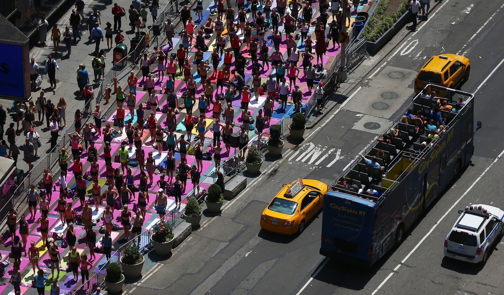 Enthusiasts perform yoga in Times Square to mark summer solstice, June 21, 2013