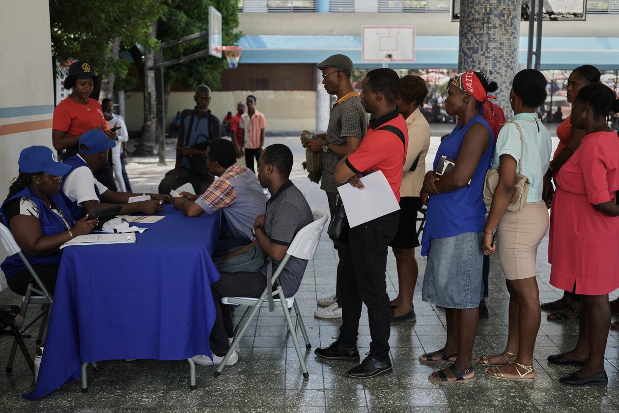 Haitians register to vote in the upcoming general election in Port-au-Prince, Haiti, Friday, July 31, 2026. (AP Photo/Odelyn Joseph)