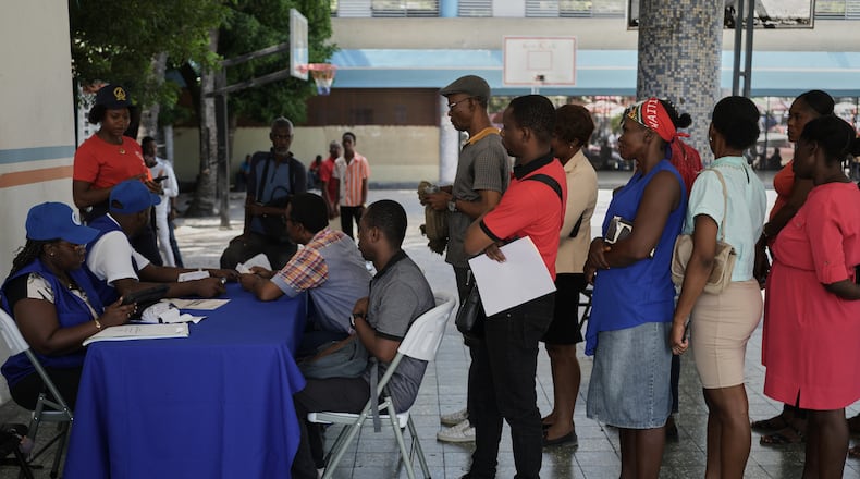 Haitians register to vote in the upcoming general election in Port-au-Prince, Haiti, Friday, July 31, 2026. (AP Photo/Odelyn Joseph)