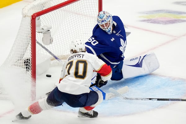 Florida Panthers' Jesper Boqvist (70) scores on Toronto Maple Leafs goaltender Joseph Woll (60) during second period NHL playoff hockey action in Toronto on Wednesday, May 14, 2025. (Frank Gunn/The Canadian Press via AP)