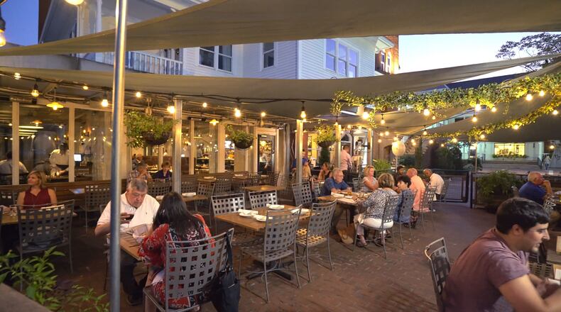 Tables on the patio at Paces & Vine have been spread out to facilitate social distancing. Courtesy of Paces & Vine