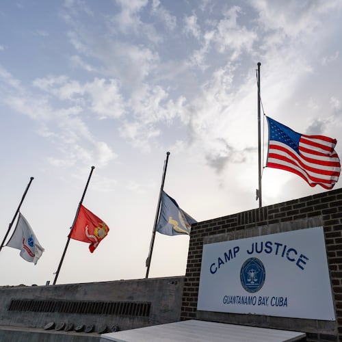 FILE - In this photo reviewed by U.S. military officials, flags fly at half-staff at Camp Justice, Aug. 29, 2021, in Guantanamo Bay Naval Base, Cuba. (AP Photo/Alex Brandon, File)