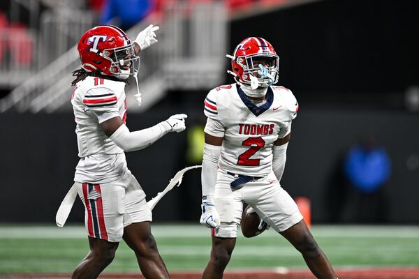 Toombs County wide receiver Nick Carroll (right) and running back Donterrius Mincey (left) react to recovering a fumbled ball by Worth County during the second half of a Class A Division I state championship game Tuesday, Dec. 16, 2025 at the Mercedes-Benz Stadium. (Daniel Varnado for the AJC)