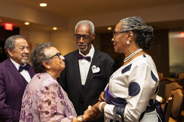 Maria Fundora (left), founder of the Purple Pansies, works the room at her fall gala-fundraiser. She's raised more than $7 million since 2017 to fight pancreatic cancer. (Courtesy of Purple Pansies)