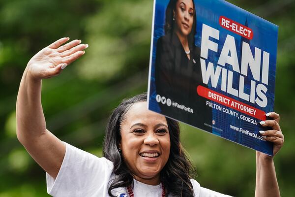 Fulton County District Attorney Fani Willis rides in a car while participating in the Inman Park Parade on Saturday, April 27, 2024, in Atlanta. (Elijah Nouvelage for The Atlanta Journal-Constitution)