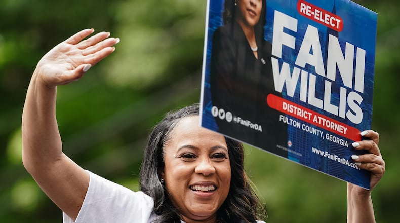 Fulton County District Attorney Fani Willis rides in a car while participating in the Inman Park Parade on Saturday, April 27, 2024, in Atlanta. (Elijah Nouvelage for The Atlanta Journal-Constitution)